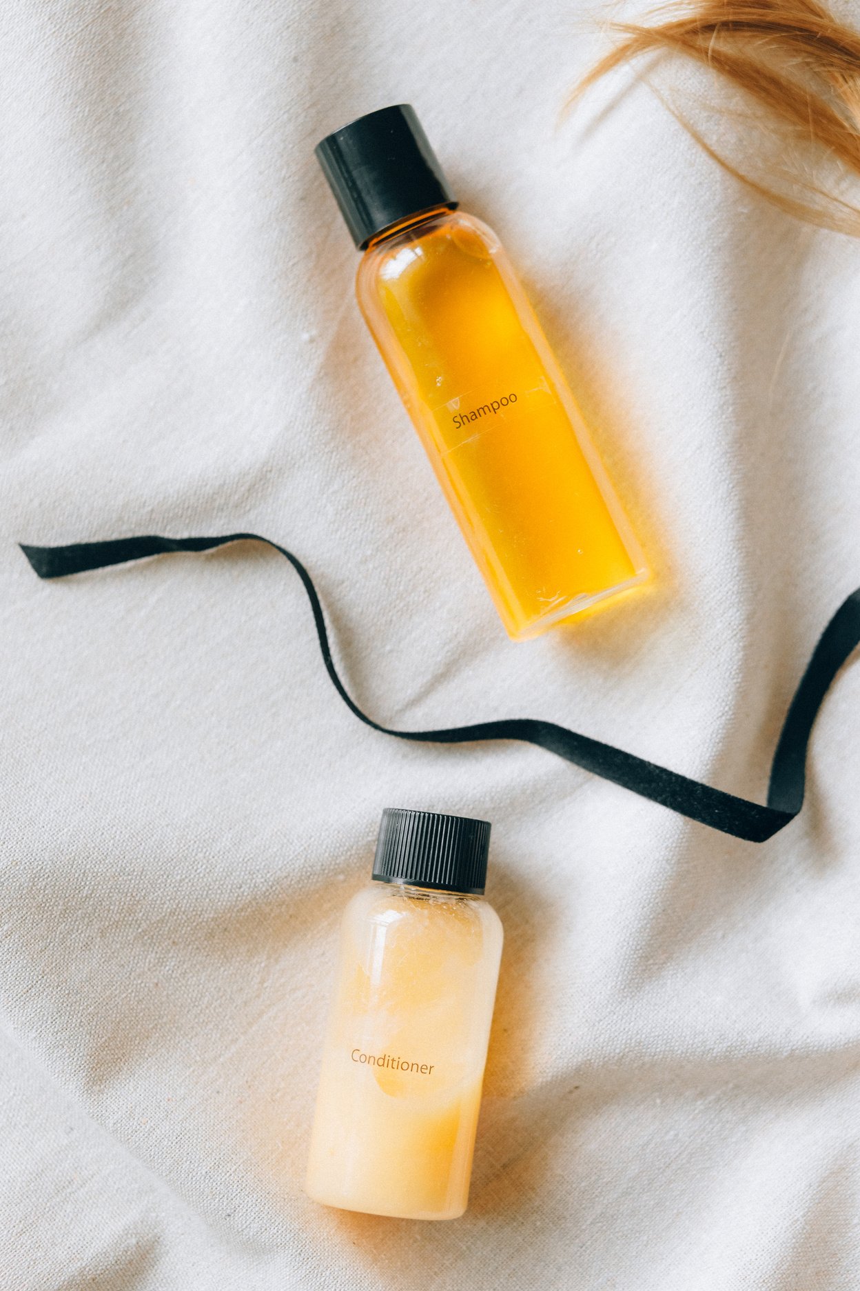 Hair Products on a White Blanket